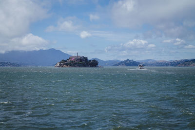 Scenic view of sea against cloudy sky