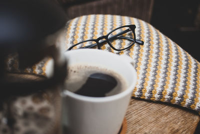 High angle view of coffee cup on table