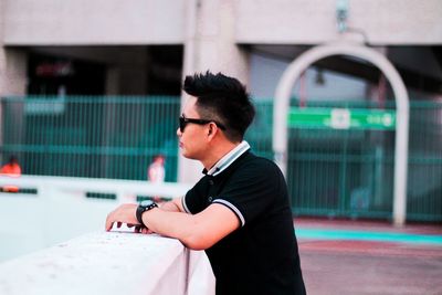 Side view of young man looking away