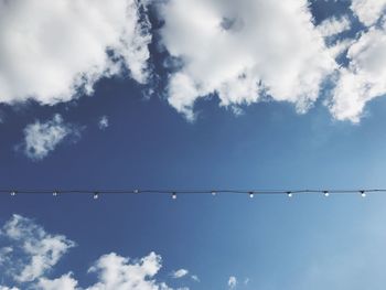 Low angle view of cables against sky