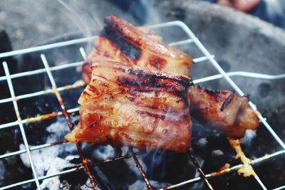 Close-up of meat on barbecue grill