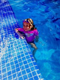 High angle view of young woman in swimming pool