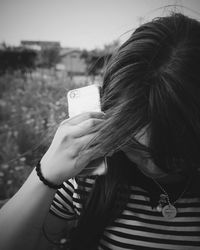 Cropped image of woman holding hair