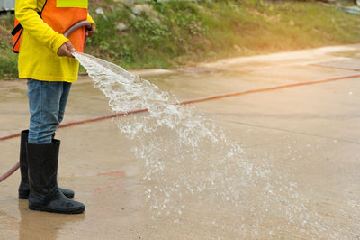 Full length of man standing in water