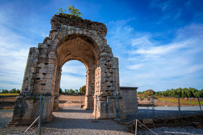 Old ruin building against cloudy sky