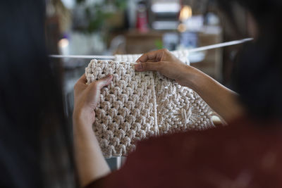 Close-up of woman knitting wool