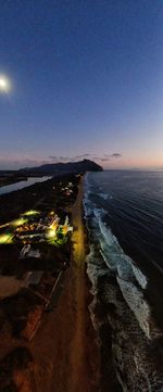 High angle view of illuminated beach against clear sky