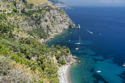 High angle view of sailboats on sea shore