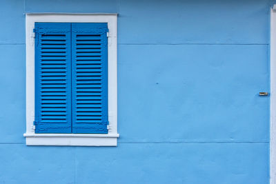 Closed blue door of building