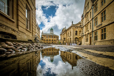 Canal amidst buildings in city