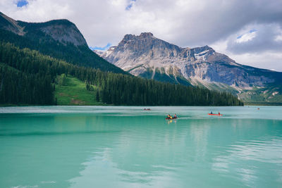 Scenic view of lake and mountains against sky