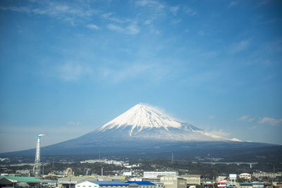 View of snowcapped mountain against blue sky