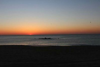 Scenic view of sea at sunset