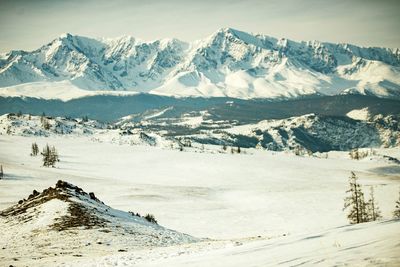 Scenic view of snow covered mountains