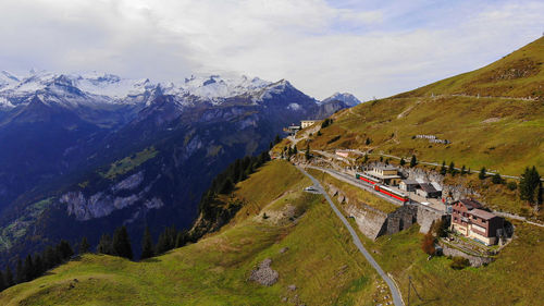 High angle view of snowcapped mountains against sky