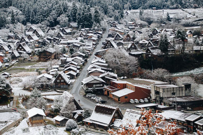 High angle view of tree and buildings in town