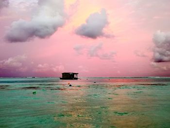 Scenic view of sea against sky at sunset