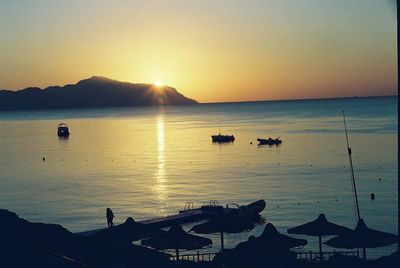 Scenic view of sea against clear sky during sunset