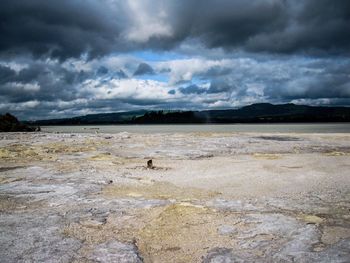 Scenic view of sea against cloudy sky