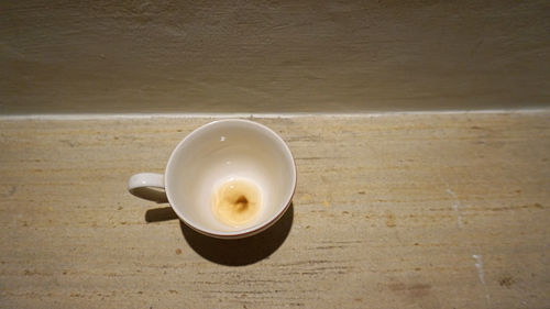 High angle view of coffee cup on table