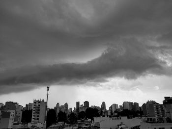 Buildings in city against sky