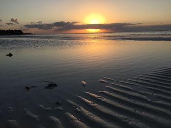 Scenic view of sunset over sea