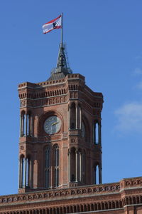 Low angle view of historical building against blue sky