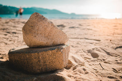 Close-up of stack of pebbles on beach