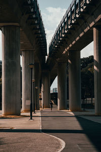 Man walking on bridge