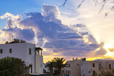 Low angle view of buildings in town against sky