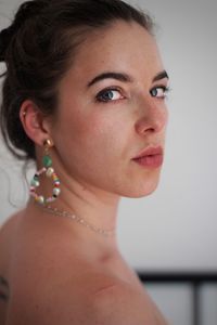 Close-up portrait of a young woman looking away