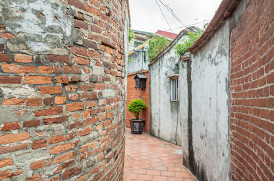 View of alley amidst buildings