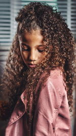 Portrait of young woman looking down