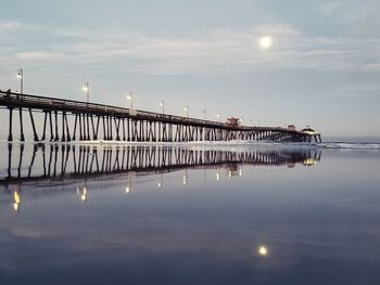 Bridge over sea against sky