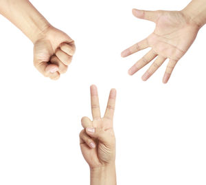 Cropped hands gesturing against white background