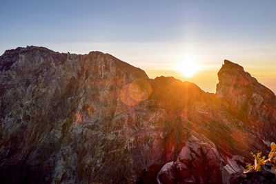 Scenic view of mountains against sky during sunset