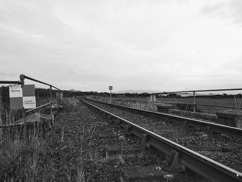 Train on railroad track against sky