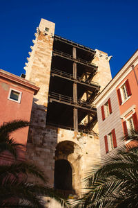 Low angle view of building against clear blue sky