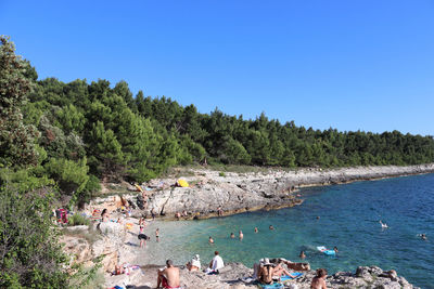 Scenic view of sea against clear blue sky