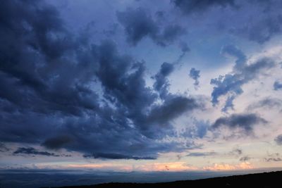 Low angle view of dramatic sky during sunset