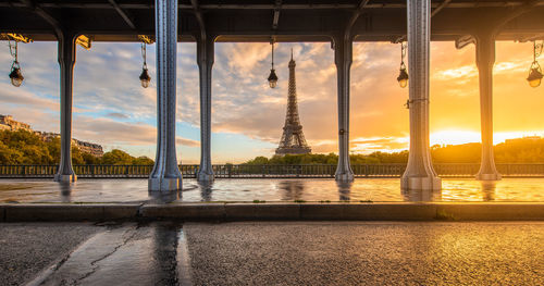 Eiffel tower and bir hakeim bridge in paris, france during sunrise.