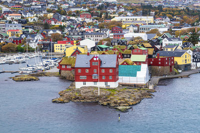 High angle view of townscape by sea