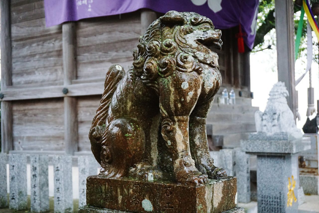 statue, sculpture, art and craft, human representation, art, creativity, religion, carving - craft product, spirituality, buddha, place of worship, focus on foreground, close-up, built structure, stone material, architecture, building exterior