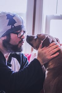 People with dog at home