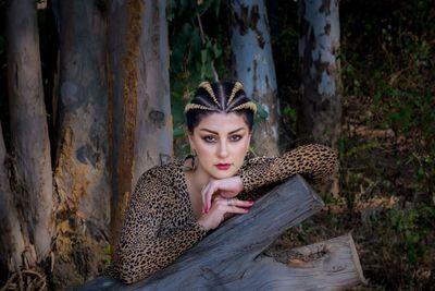 Portrait of woman sitting in a forest