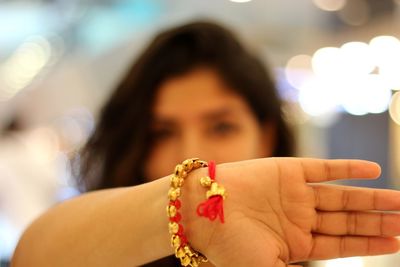 Close-up of woman showing bangle