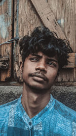 Portrait of young man standing outdoors