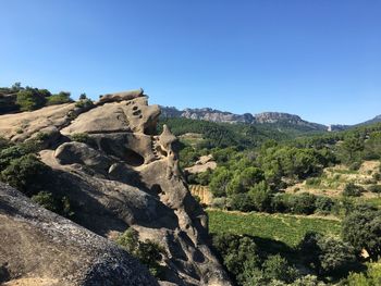 Scenic view of rocky mountains against clear sky