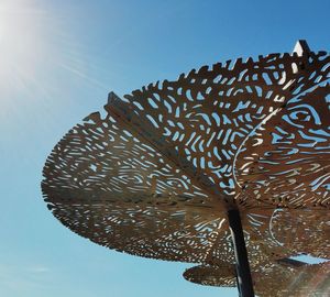 Low angle view of umbrella against clear sky