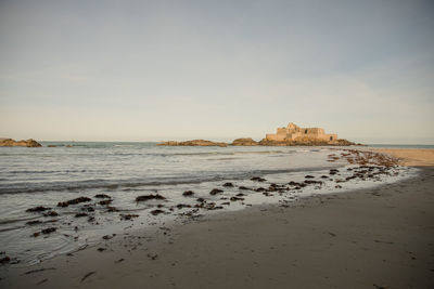 Scenic view of beach against sky